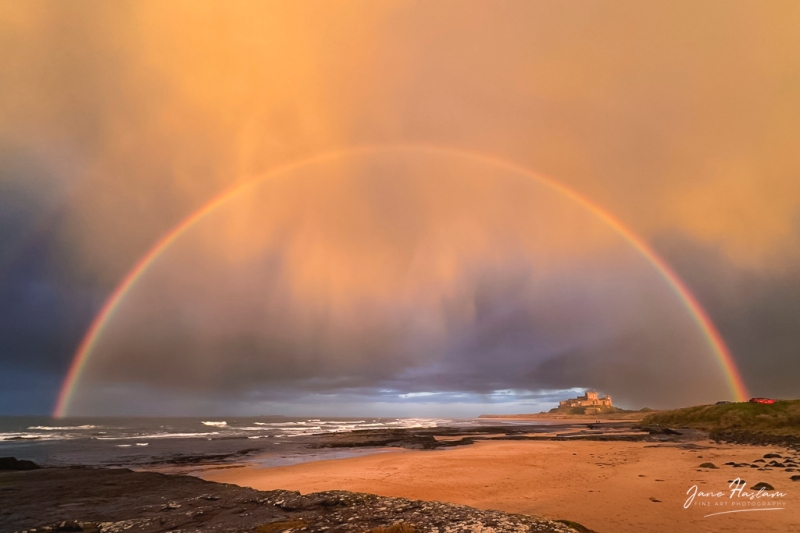 Rainbow and storm clouds at Bamburgh Castle